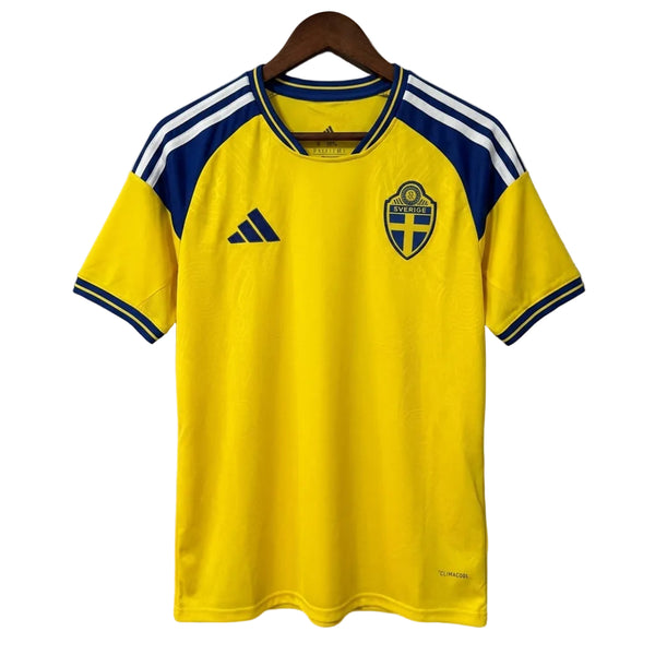 Yellow sports jersey with blue and white accents on a hanger against a gray background