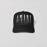 Black cap with 'AMIRI' logo on a light gray background