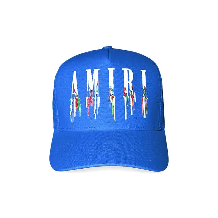Blue cap with 'AMIRI' logo on a white background