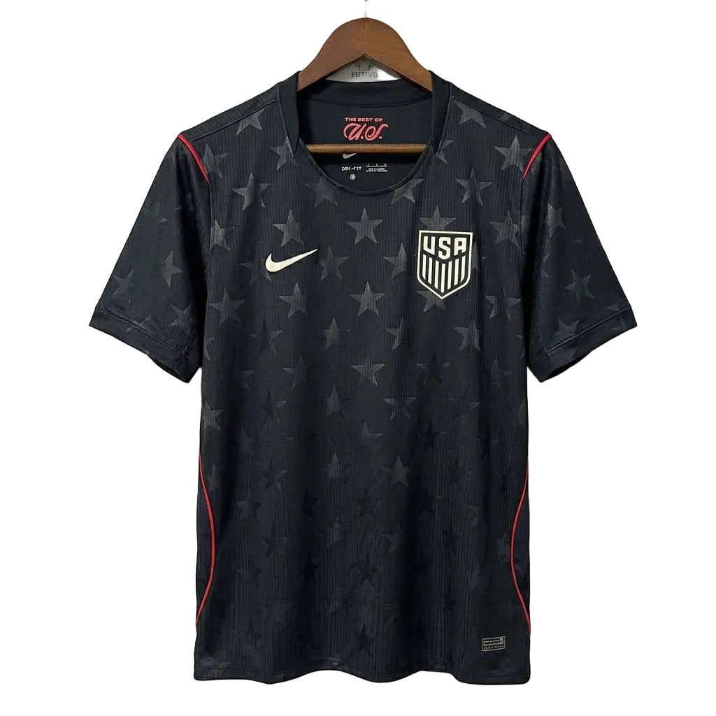 Black sports jersey with star pattern and USA logo on a hanger against a white background