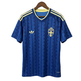 Blue sports jersey with yellow accents on a hanger against a gray background