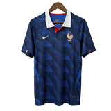 Blue sports jersey with Nike logo on a hanger against a gray background