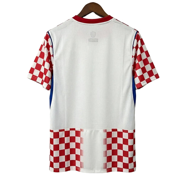 White sports jersey with red and blue checkered sleeves and bottom on a gray background