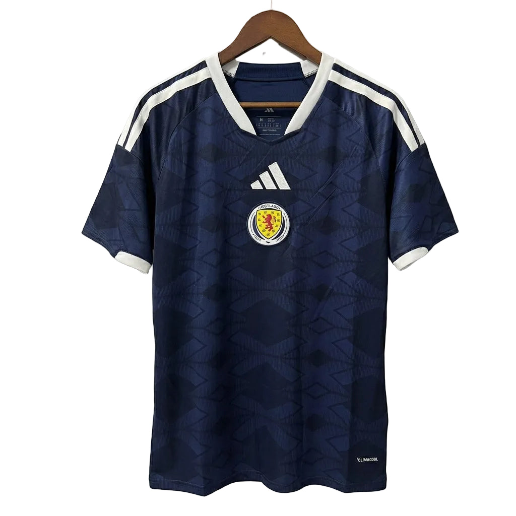 Navy blue sports jersey with white accents on a hanger against a gray background